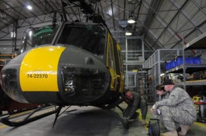 Left to right: Chief Warrant Officer 4 Michael Chickilly, UH-1 standardization pilot and maintenance examiner, walks Maj. Heidi Ridenhour-Jones and Capt. Sam Redding through their pre-flight evaluation March 25 in preparation for their check ride on a UH-1 Huey helicopter. Ridenhour-Jones and Redding are two of the last four pilots the Joint Multinational Readiness Center will train to operate the aircraft that will be completely retired from the Army by 2012 after a 50-year career as the Army's workhorse, used most extensively and famously in Vietnam. 