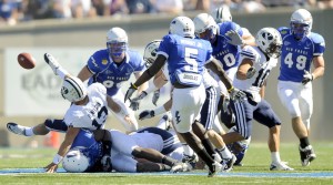 Air Force defenders cause Brigham Young quarterback Riley Nelson to fumble during first half action of an NCAA college football game at the Air Force Academy on Saturday, Sept. 11, 2010.  The game was BYU's last game against Air Force as a member of the Mountain West Conference.
